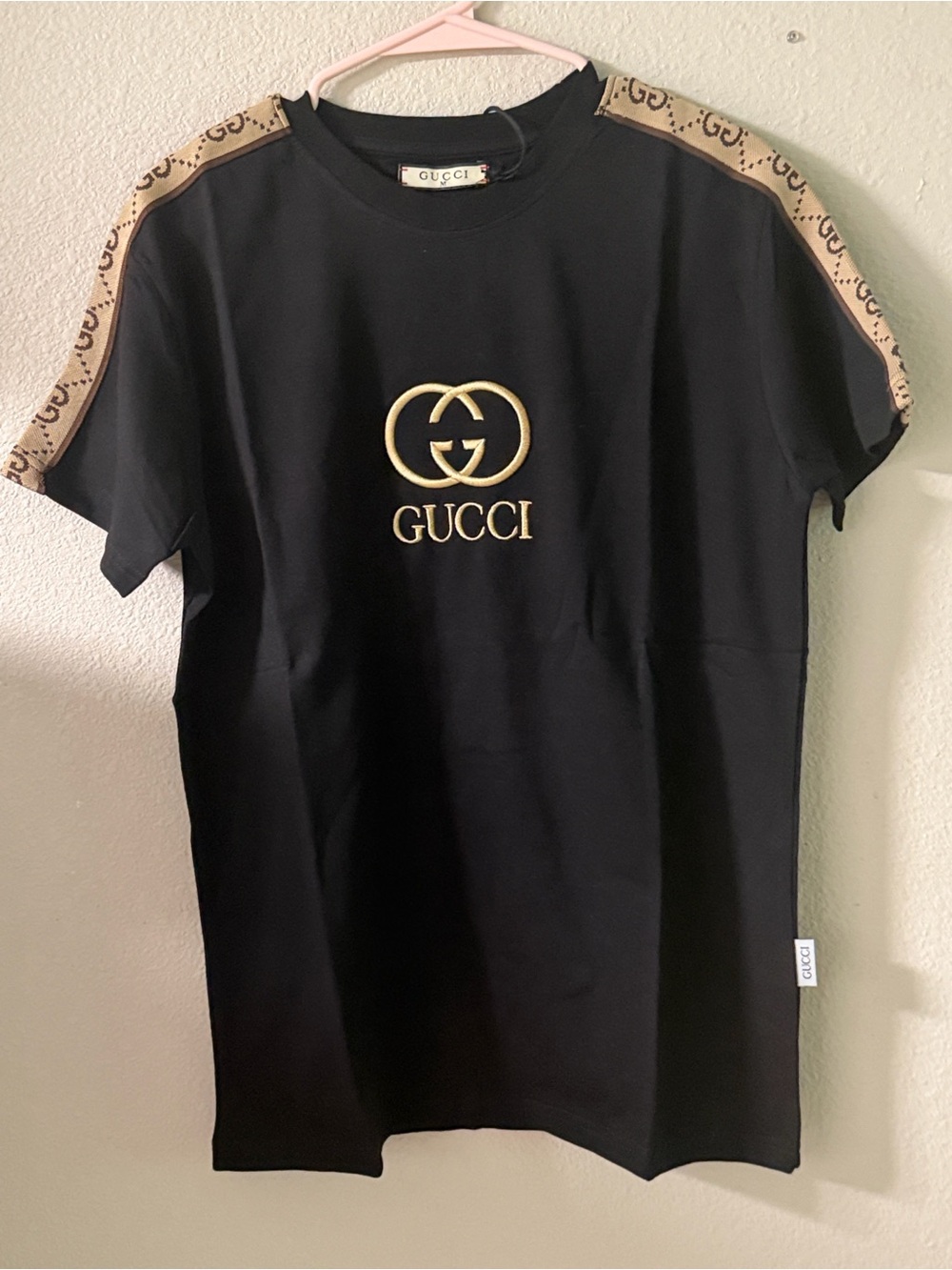Gucci Black Tee with Beige GG Shoulder Stripes and Gold Logo